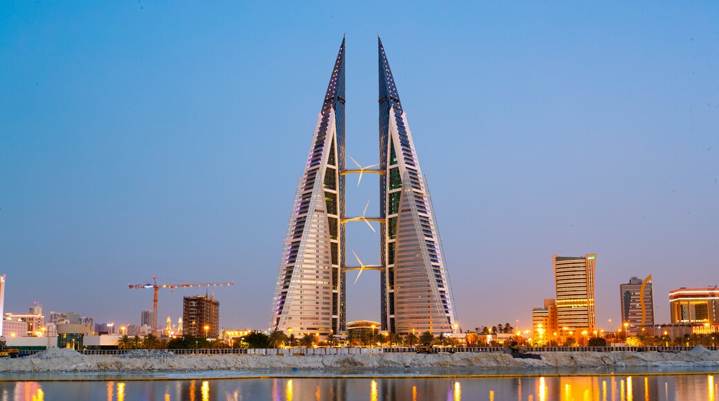 Bahrain World Trade Center which includes a city, modern architecture and night scenes
