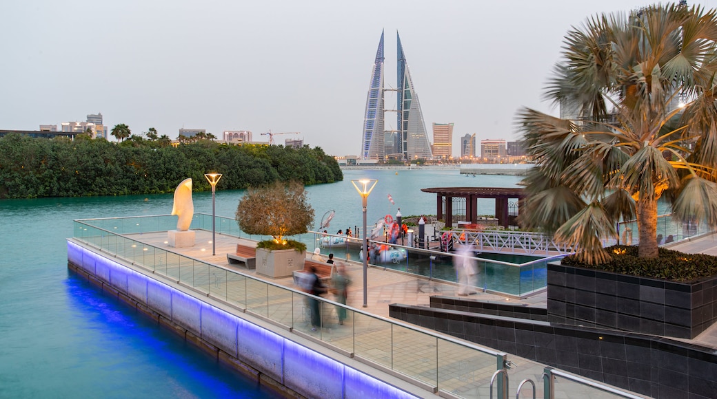 Manama which includes modern architecture, a high rise building and a bay or harbor