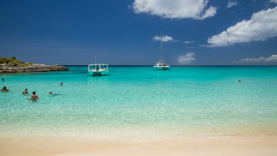 Mullet Bay Beach which includes tropical scenes, general coastal views and a beach