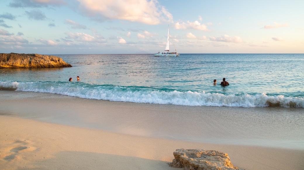 Cupecoy featuring swimming, a sunset and a sandy beach