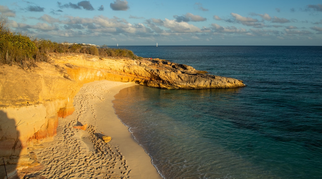 Cupecoy showing a sandy beach, rocky coastline and general coastal views