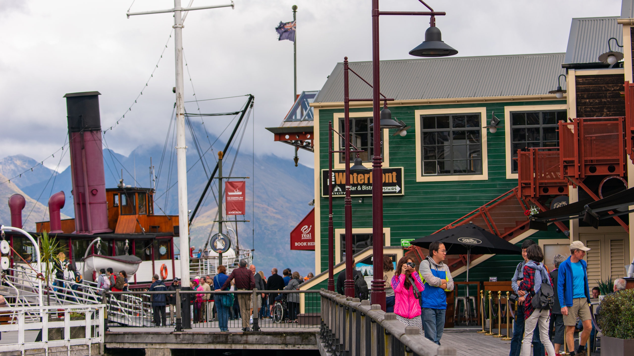 Steamer Wharf which includes a bay or harbor and street scenes