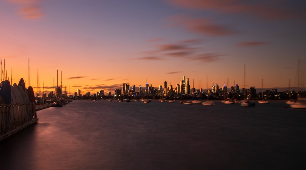 St Kilda Pier showing a sunset, a city and a bay or harbor