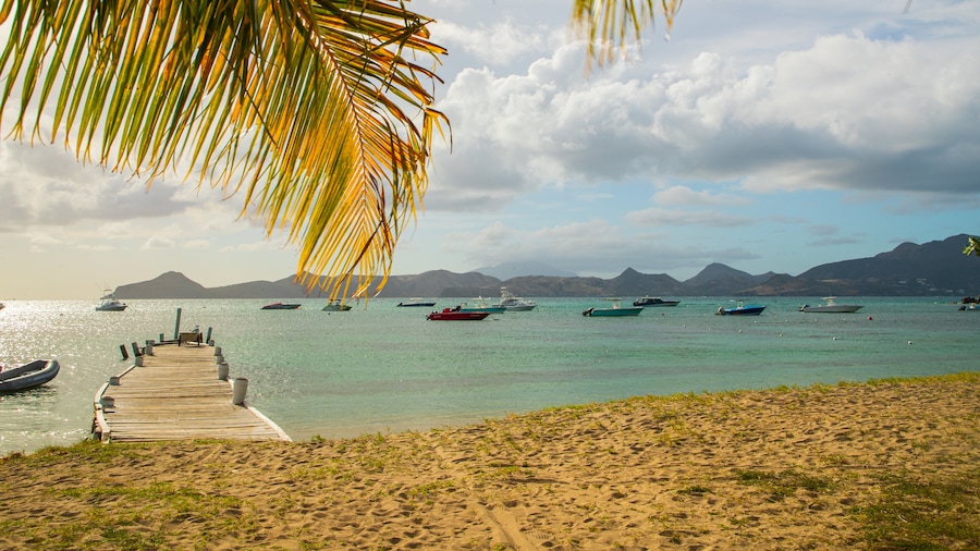 Oualie Beach which includes a sandy beach, tropical scenes and general coastal views