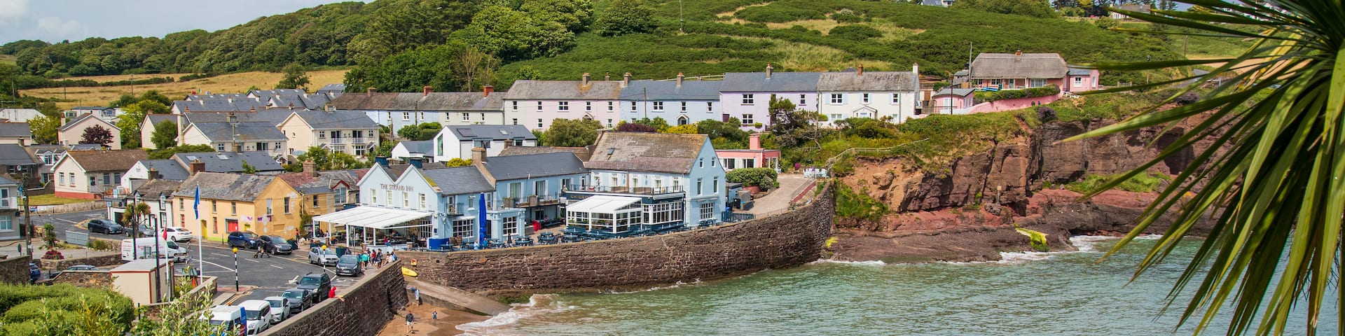 Dunmore East featuring rugged coastline and a coastal town
