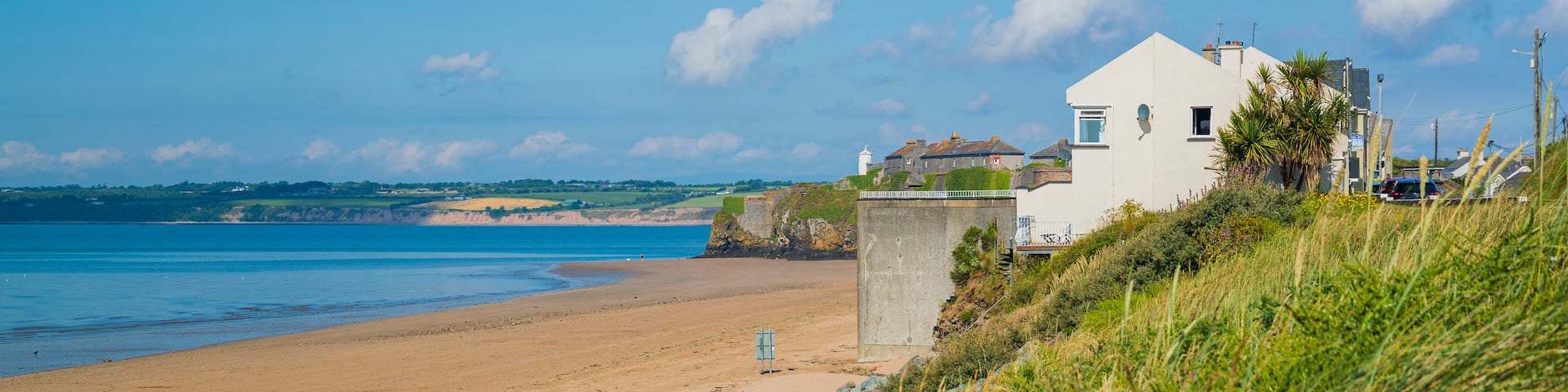 Duncannon Beach featuring a coastal town and a sandy beach