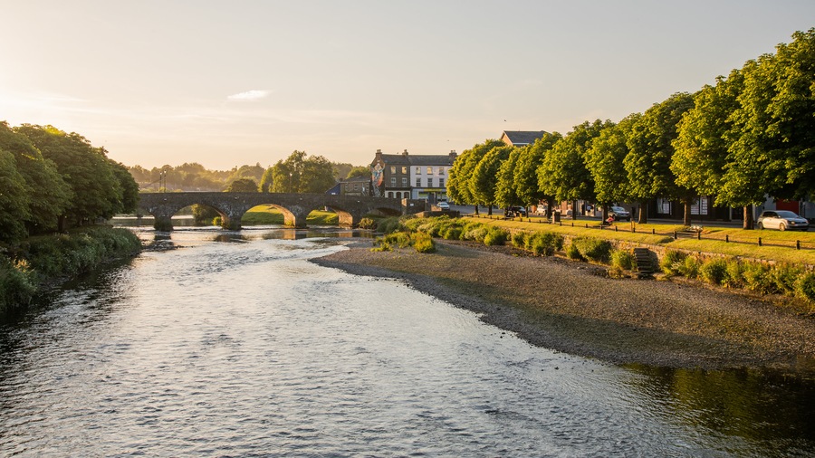 Enniscorthy showing a sunset, a bridge and a river or creek