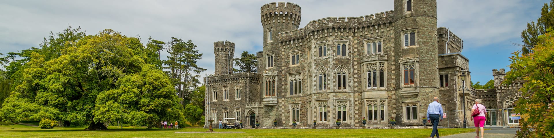 Johnstown Castle & Gardens featuring chateau or palace and heritage architecture as well as a couple