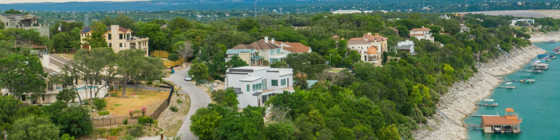 Lake Travis which includes general coastal views, landscape views and a coastal town