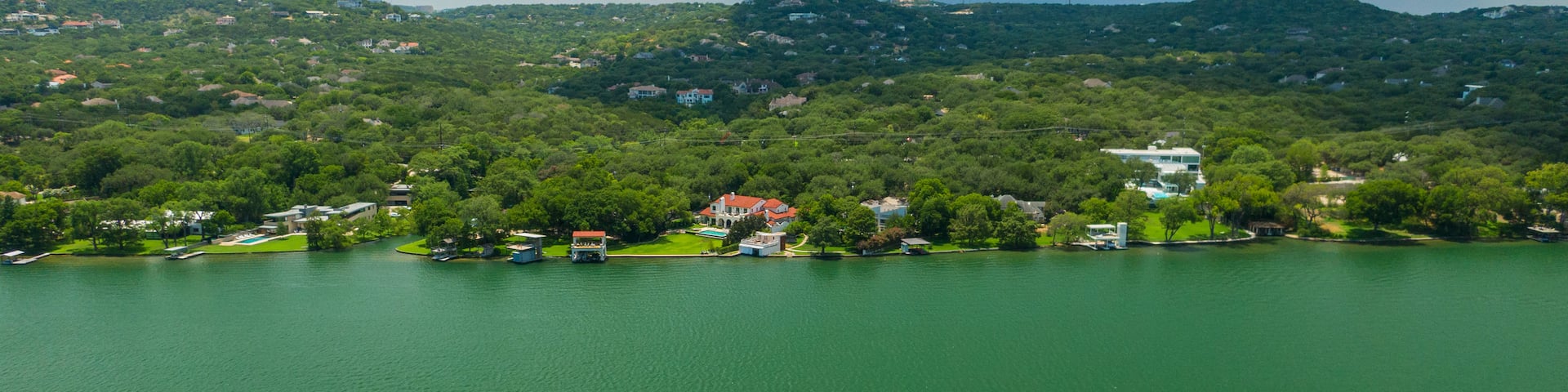 Mount Bonnell which includes a river or creek, landscape views and a small town or village