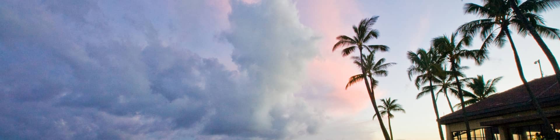 Poipu featuring tropical scenes, general coastal views and a sunset