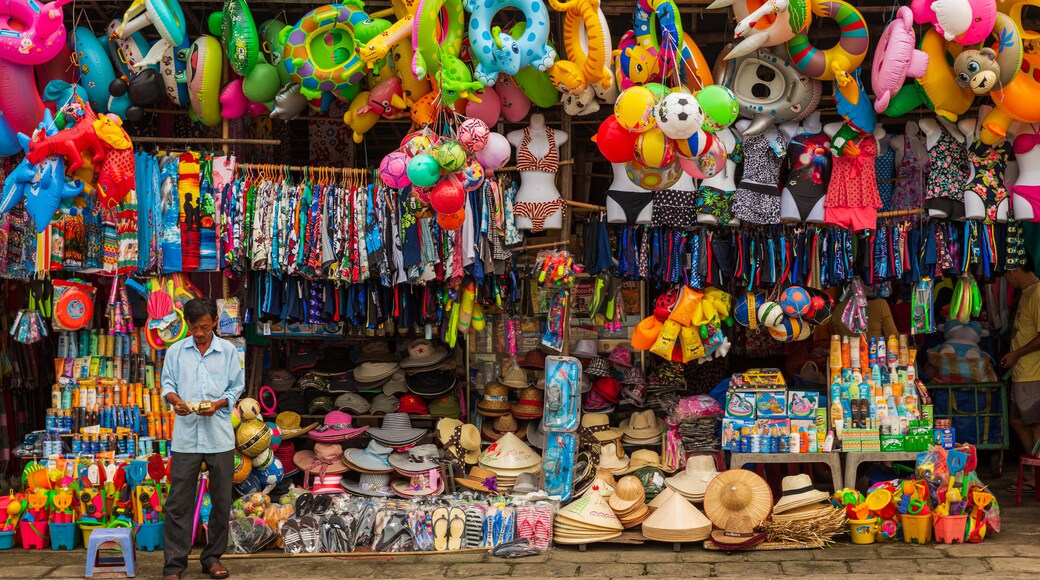 Cua Dai Beach showing street scenes and markets as well as an individual male