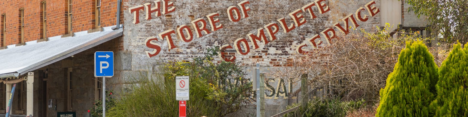 Mccrossin\'s Mill Museum featuring signage, a small town or village and heritage elements