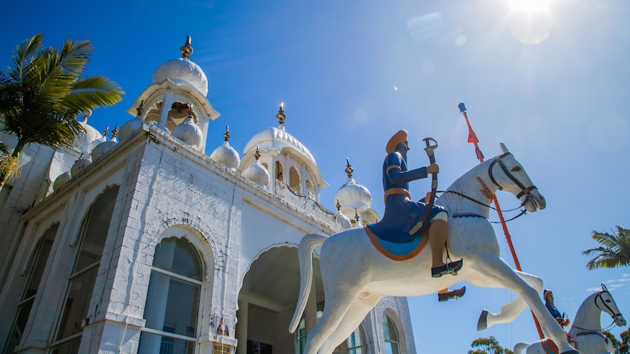Guru Nanak Sikh Temple showing a sunset, a mosque and a temple or place of worship