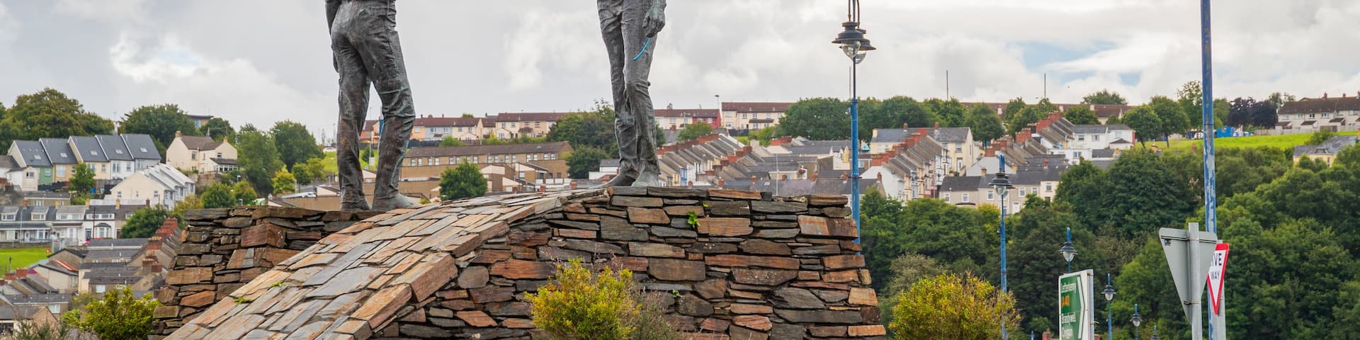 Hands Across the Divide featuring a statue or sculpture and outdoor art