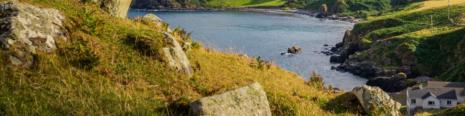 Ballycastle which includes general coastal views and tranquil scenes