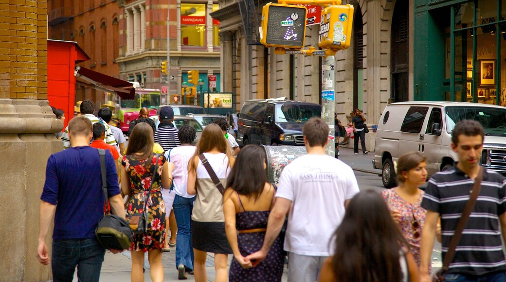 SoHo - Tribeca which includes a city and street scenes as well as a large group of people