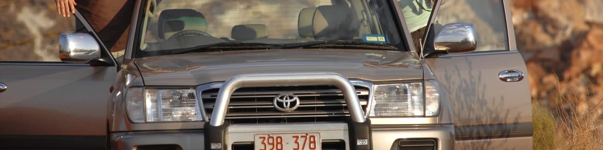 Alice Springs featuring vehicle touring and desert views as well as a couple