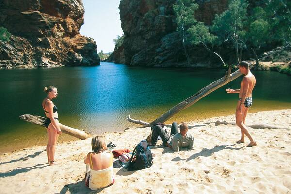 Ellery Creek Big Hole which includes a sandy beach and general coastal views as well as a small group of people