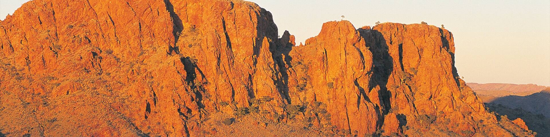 Alice Springs featuring mountains and a sunset