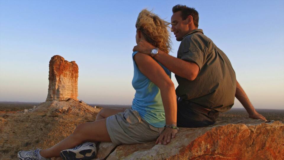 Chambers Pillar showing desert views, a gorge or canyon and a sunset