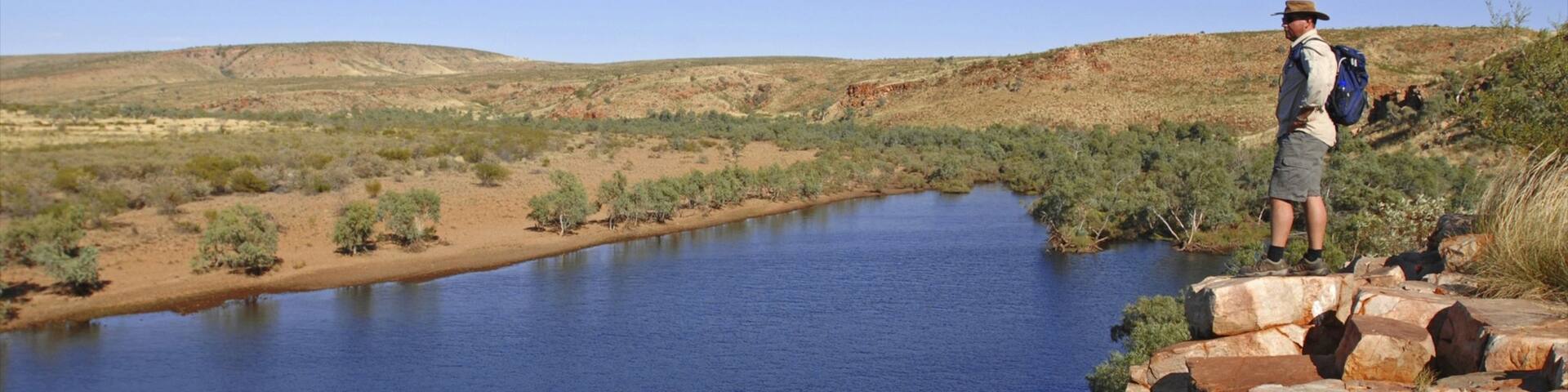 Red Centre featuring hiking or walking, tranquil scenes and a river or creek