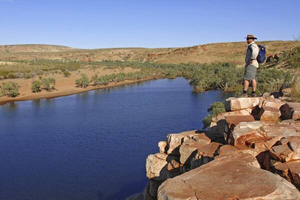 Red Centre featuring tranquil scenes, a river or creek and hiking or walking