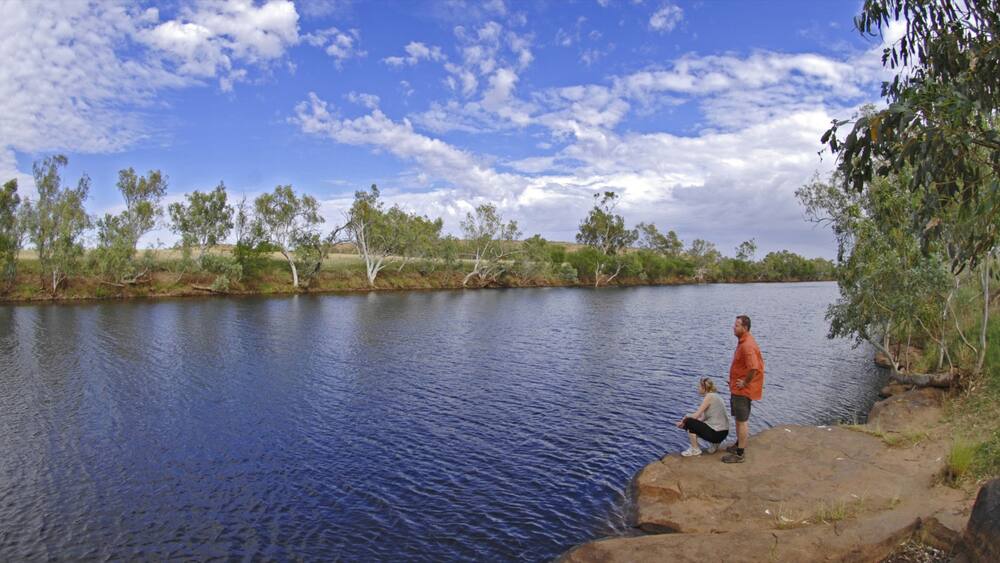 Red Centre featuring hiking or walking and a river or creek as well as a couple