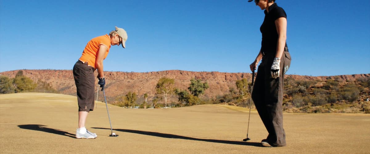 Alice Springs showing golf and tranquil scenes as well as a small group of people