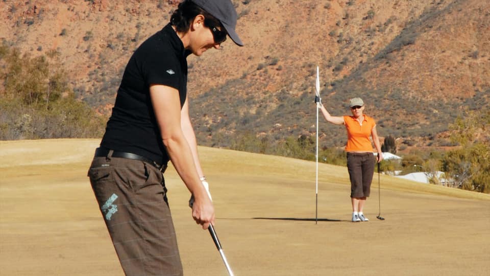 Alice Springs featuring golf and tranquil scenes as well as a couple