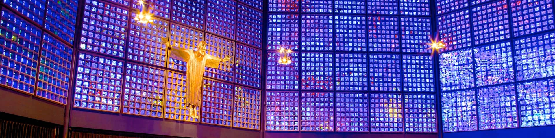 Kaiser Wilhelm Memorial Church which includes a church or cathedral, religious elements and interior views