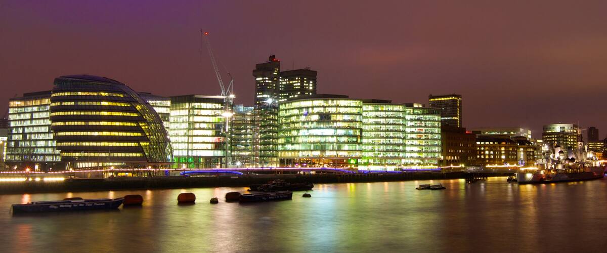 London City Hall which includes night scenes, a city and modern architecture