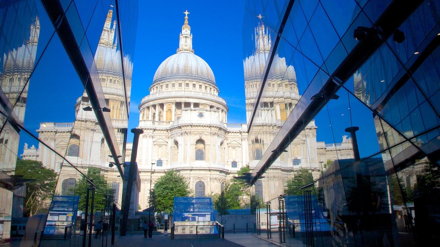 Reflection of St. Paul's Cathedral dome in modern glass architecture.
