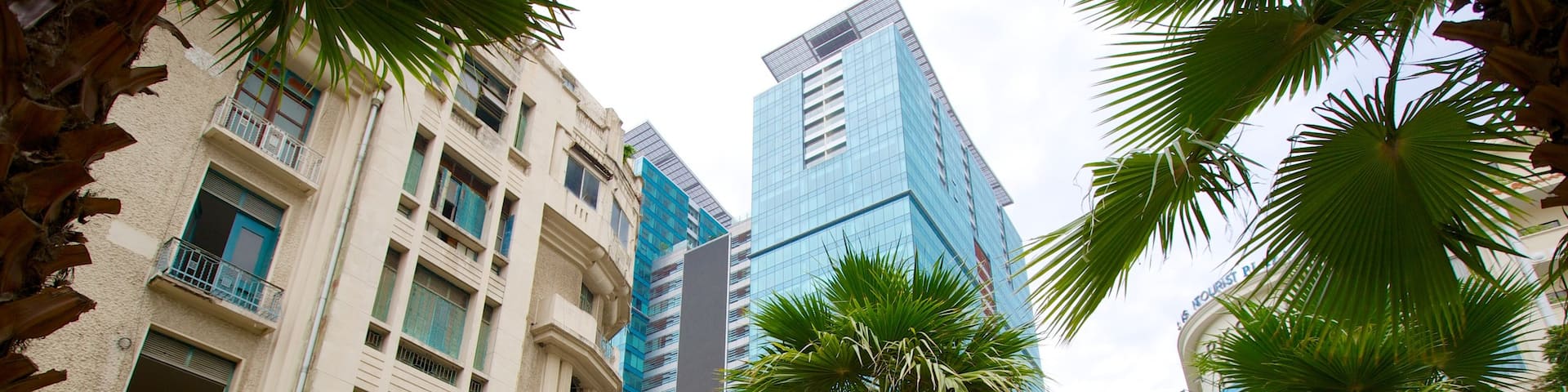 Ho Chi Minh Square which includes a high rise building, tropical scenes and street scenes