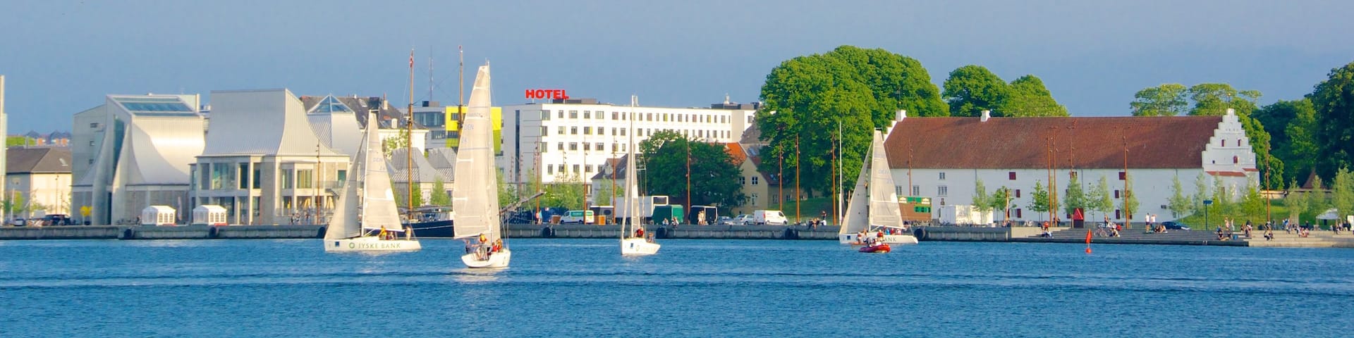 Aalborg Harbour showing a coastal town, sailing and a bay or harbor