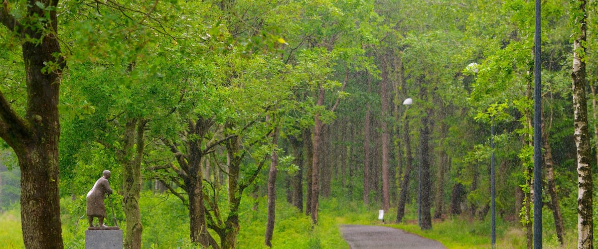 Denmark which includes forest scenes, outdoor art and a park