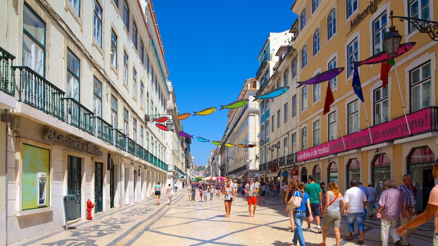 Lisbon featuring a city and heritage architecture as well as a large group of people