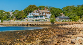 Eastern Point Lighthouse featuring a house, general coastal views and a bay or harbor