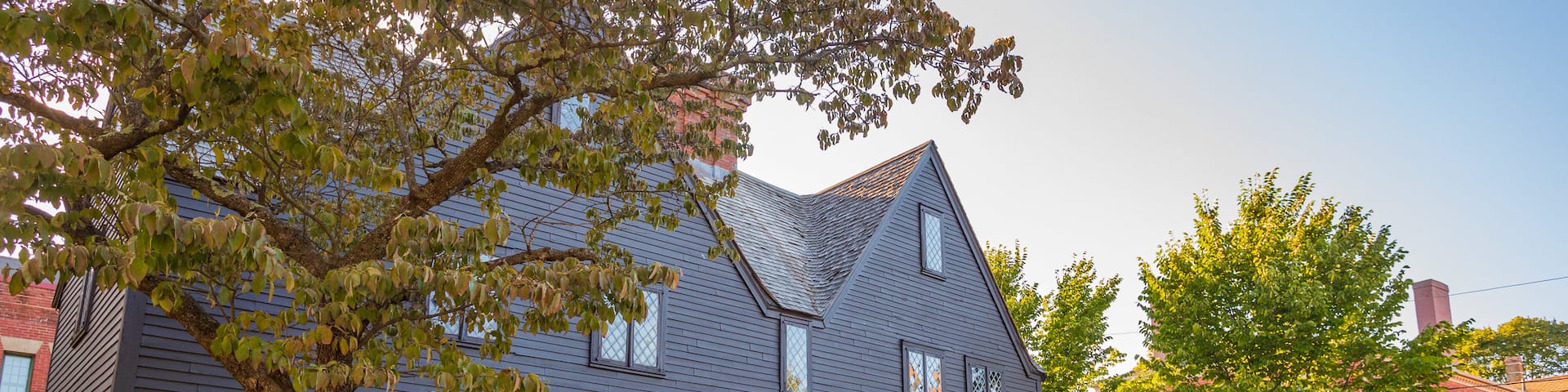Witch House featuring a small town or village and signage