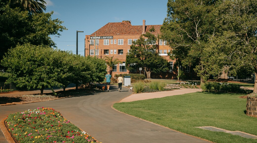 Queens Park featuring a garden as well as a couple