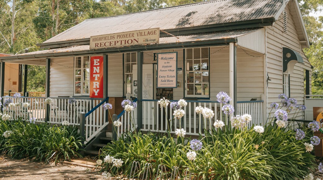 Highfields Pioneer Village which includes signage and flowers