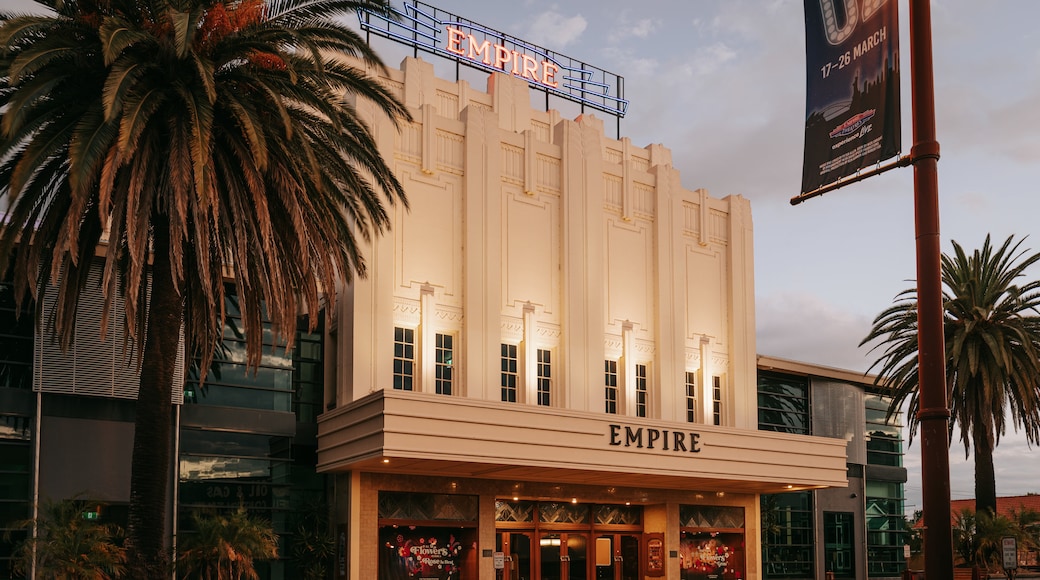 Empire Theatre featuring signage and a sunset