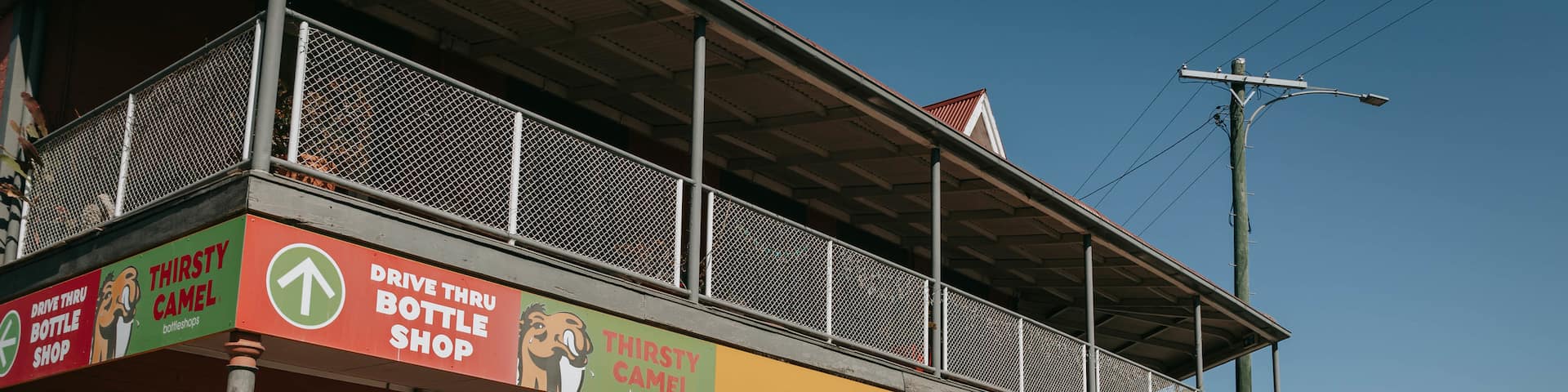 Oakey which includes signage and a small town or village