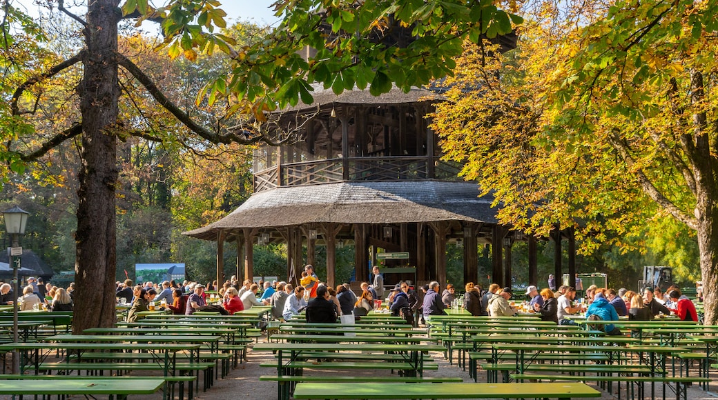 Chinesischer Turm featuring outdoor eating and heritage architecture as well as a large group of people