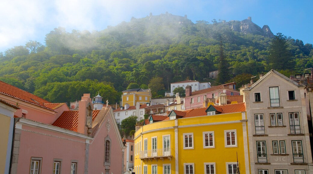 Sintra which includes a house, mountains and mist or fog