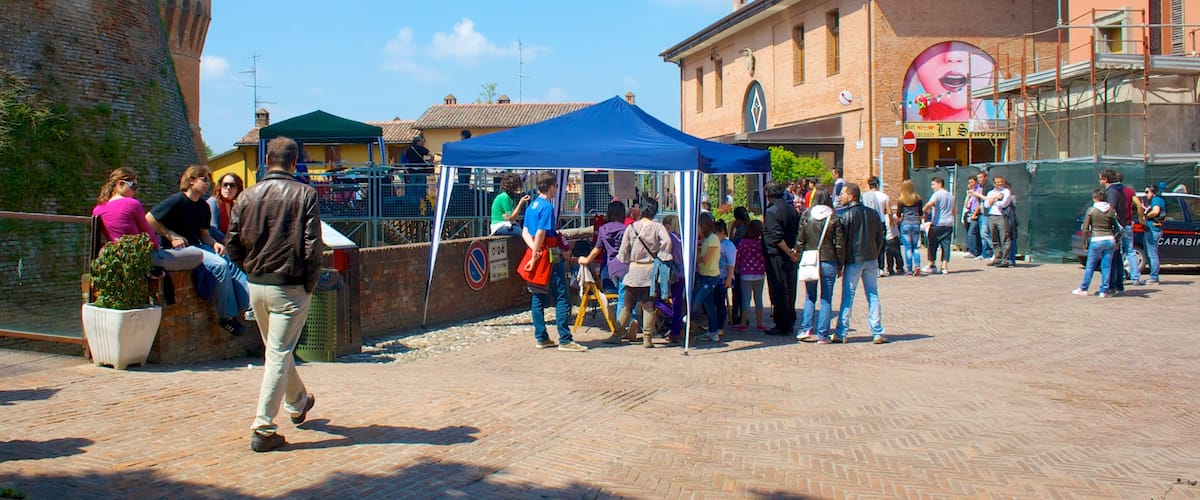 Dozza which includes a square or plaza as well as a large group of people