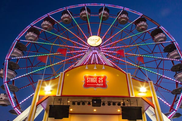 Galveston Island Historic Pleasure Pier which includes rides and night scenes