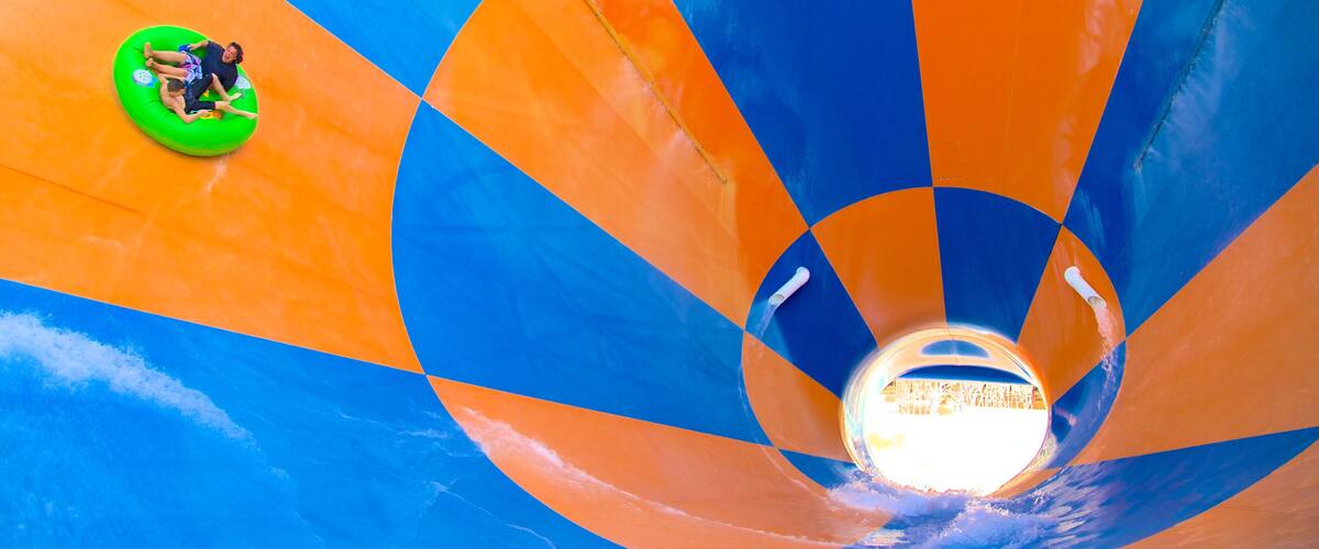 Wet\'n\'Wild Water World showing rides and a water park as well as a couple