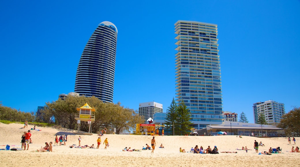 Kurrawa Beach which includes a sandy beach, modern architecture and a skyscraper