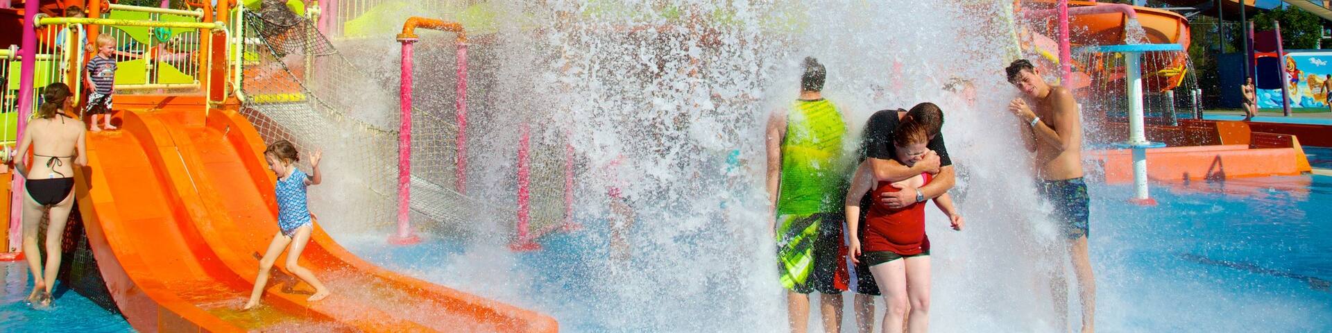 WhiteWater World featuring a water park and a pool as well as a small group of people